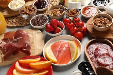 Different tasty food served for brunch on grey table