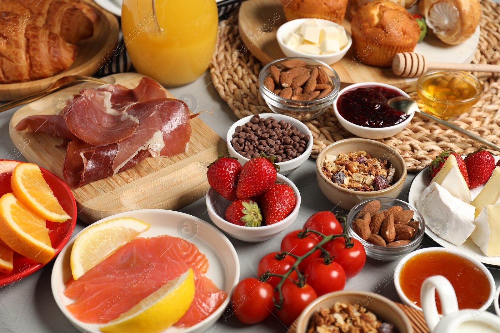 Photo of Different tasty food served for brunch on grey table