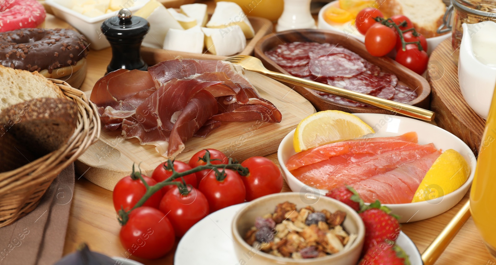 Photo of Different tasty food served for brunch on wooden table