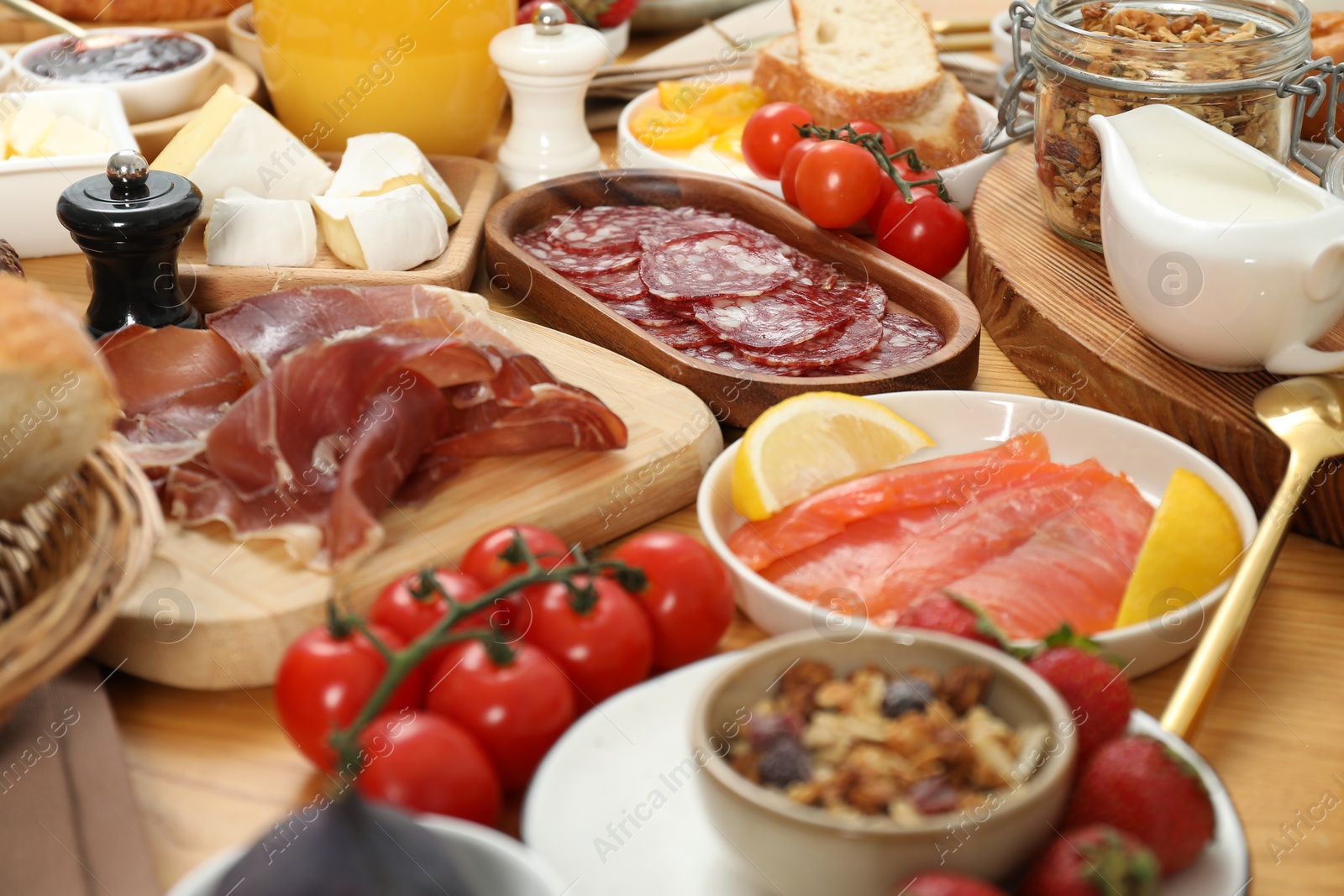 Photo of Different tasty food served for brunch on wooden table