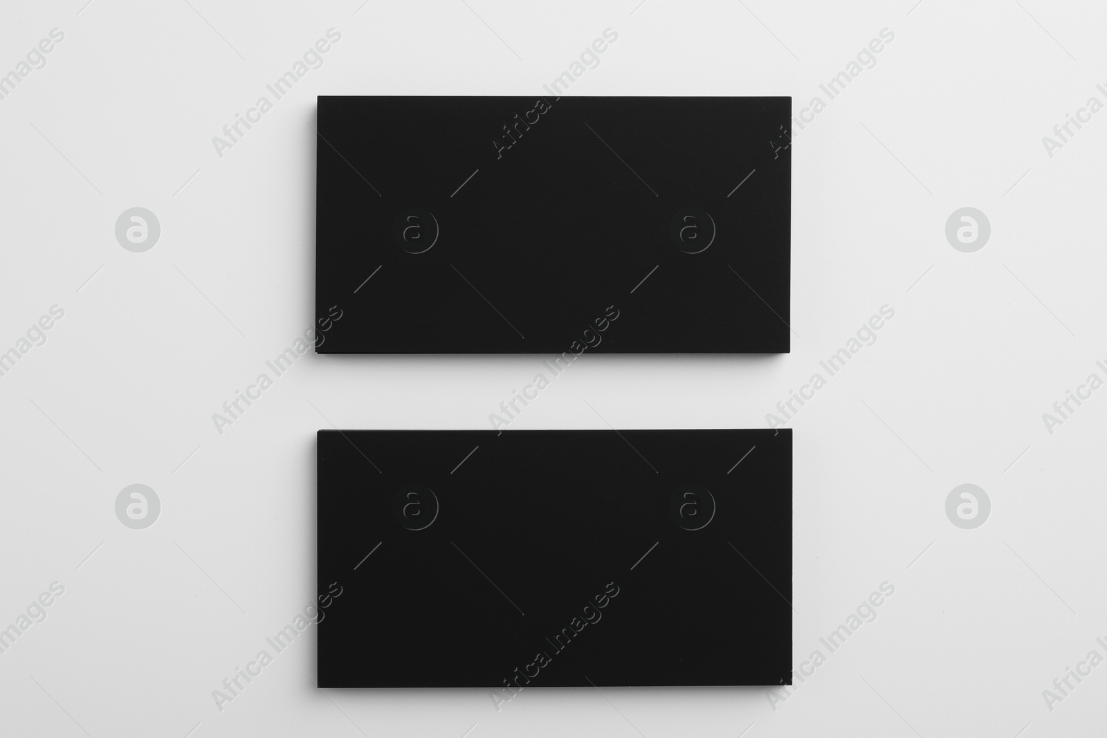 Photo of Blank business cards on light grey background, top view. Mockup for design