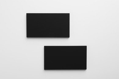 Blank business cards on light grey background, top view. Mockup for design