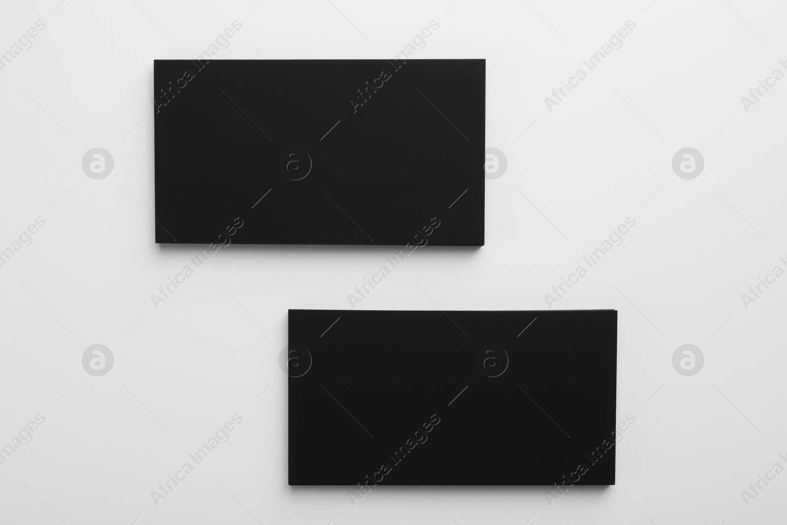 Photo of Blank business cards on light grey background, top view. Mockup for design