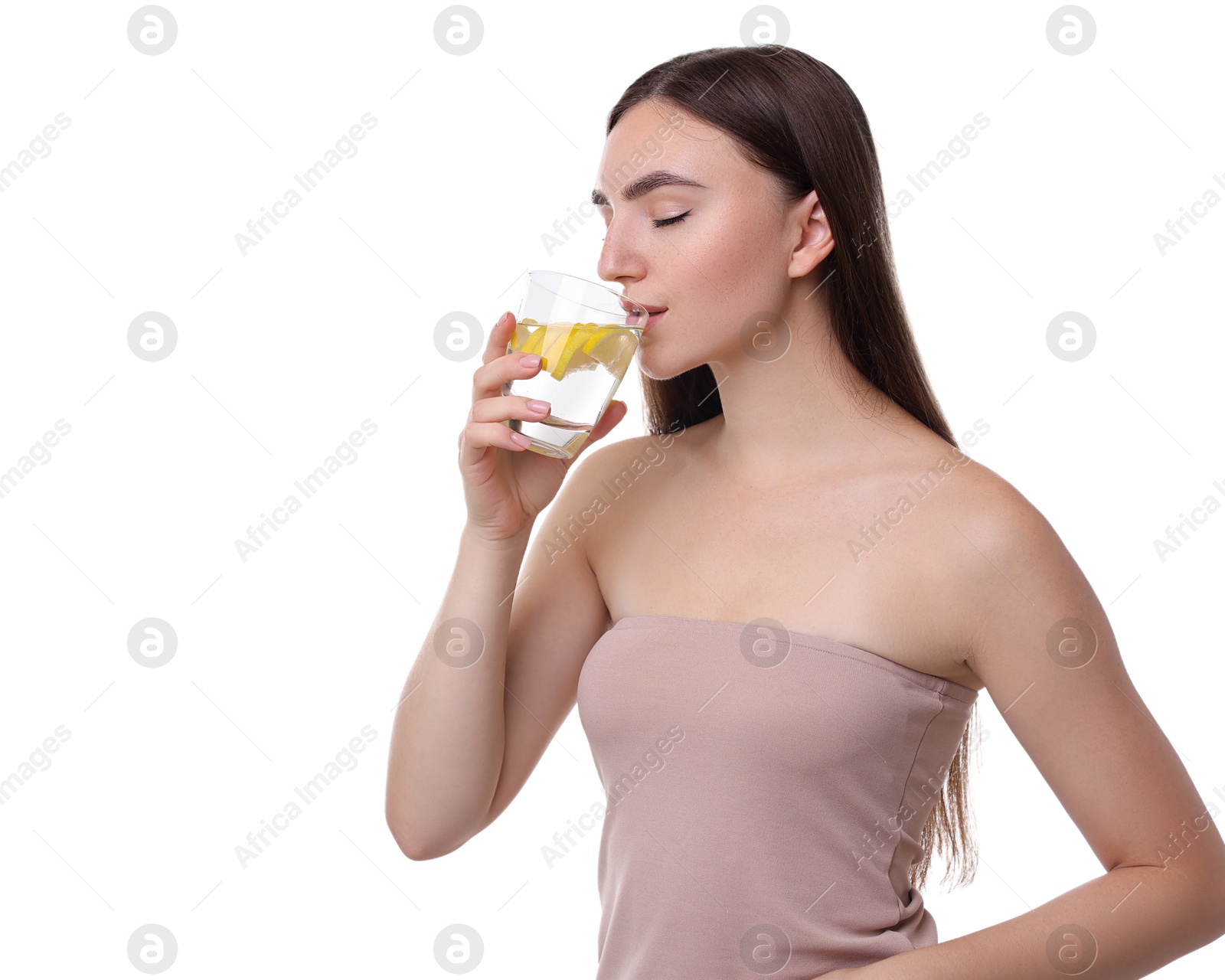 Photo of Woman drinking water with lemon on white background