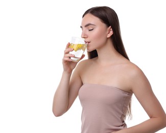 Woman drinking water with lemon on white background