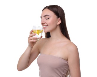 Woman drinking water with lemon on white background