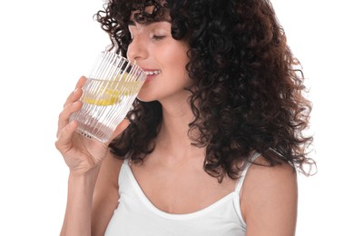 Woman drinking water with lemon on white background