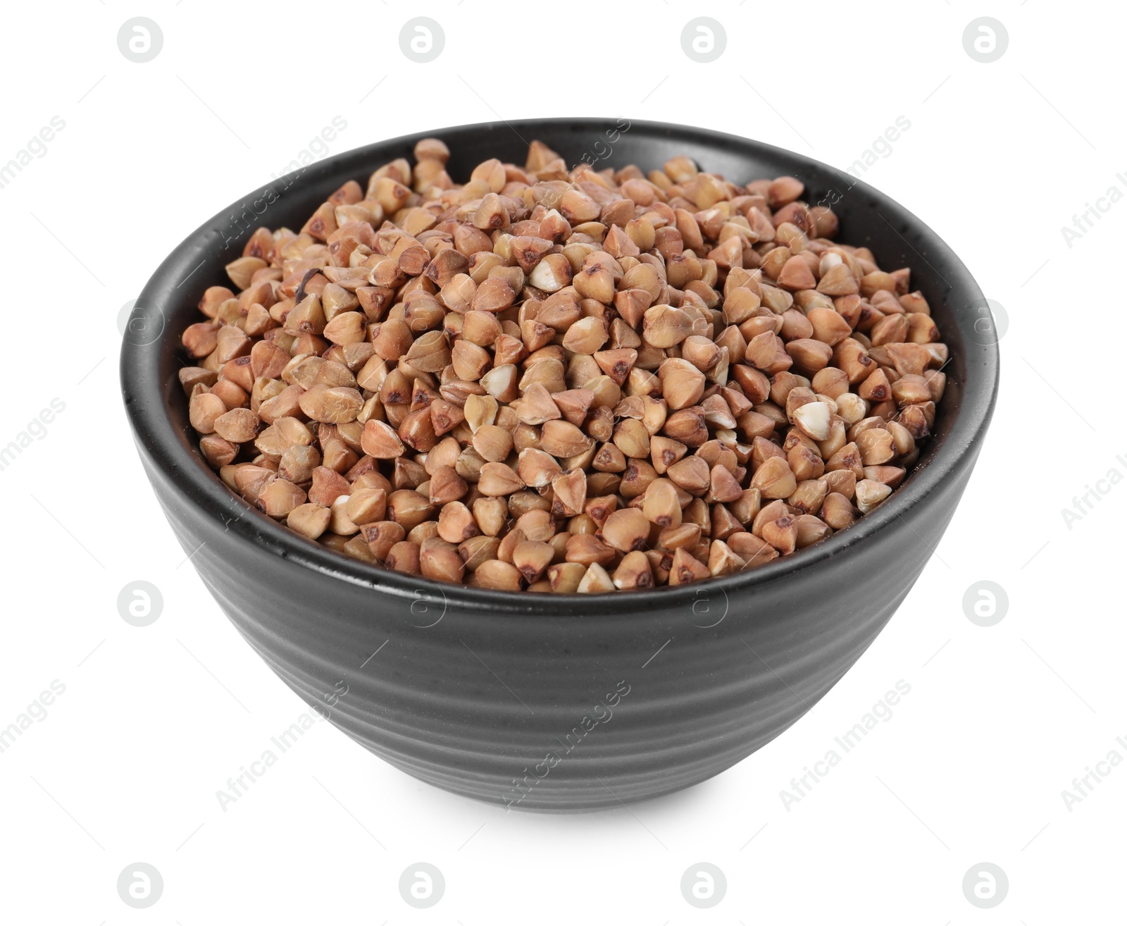 Photo of Raw buckwheat in bowl isolated on white