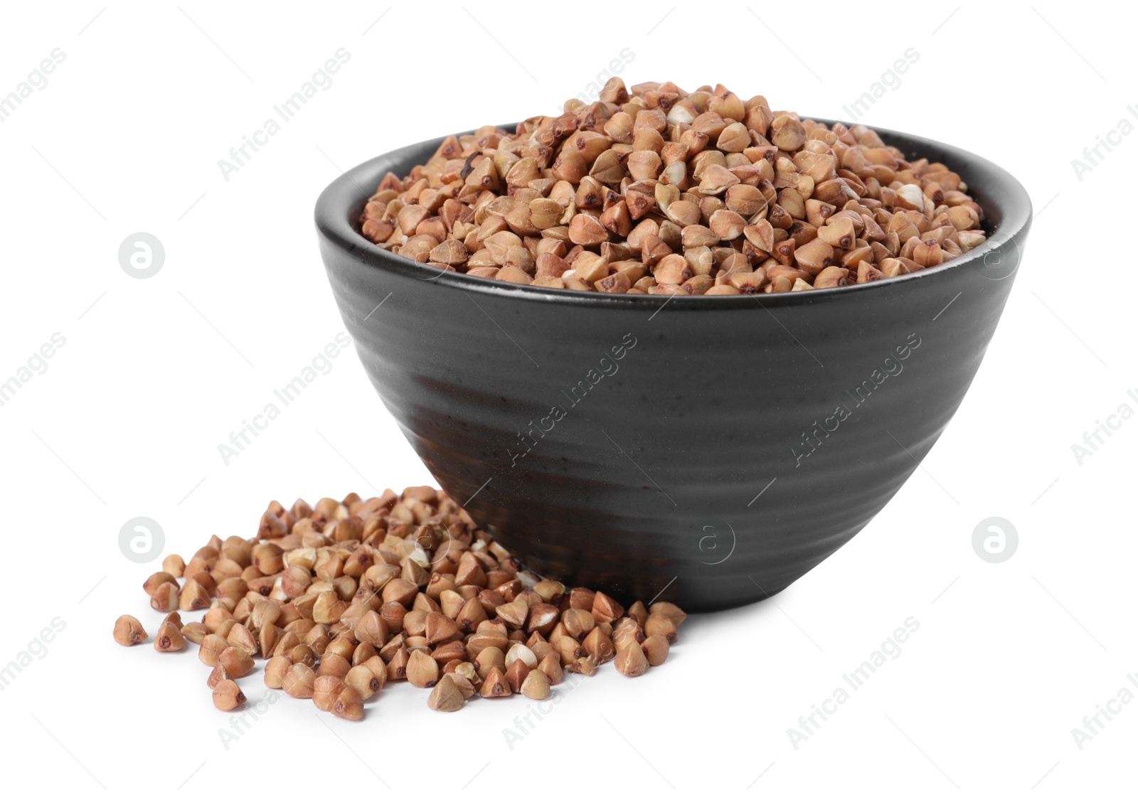 Photo of Raw buckwheat in bowl isolated on white