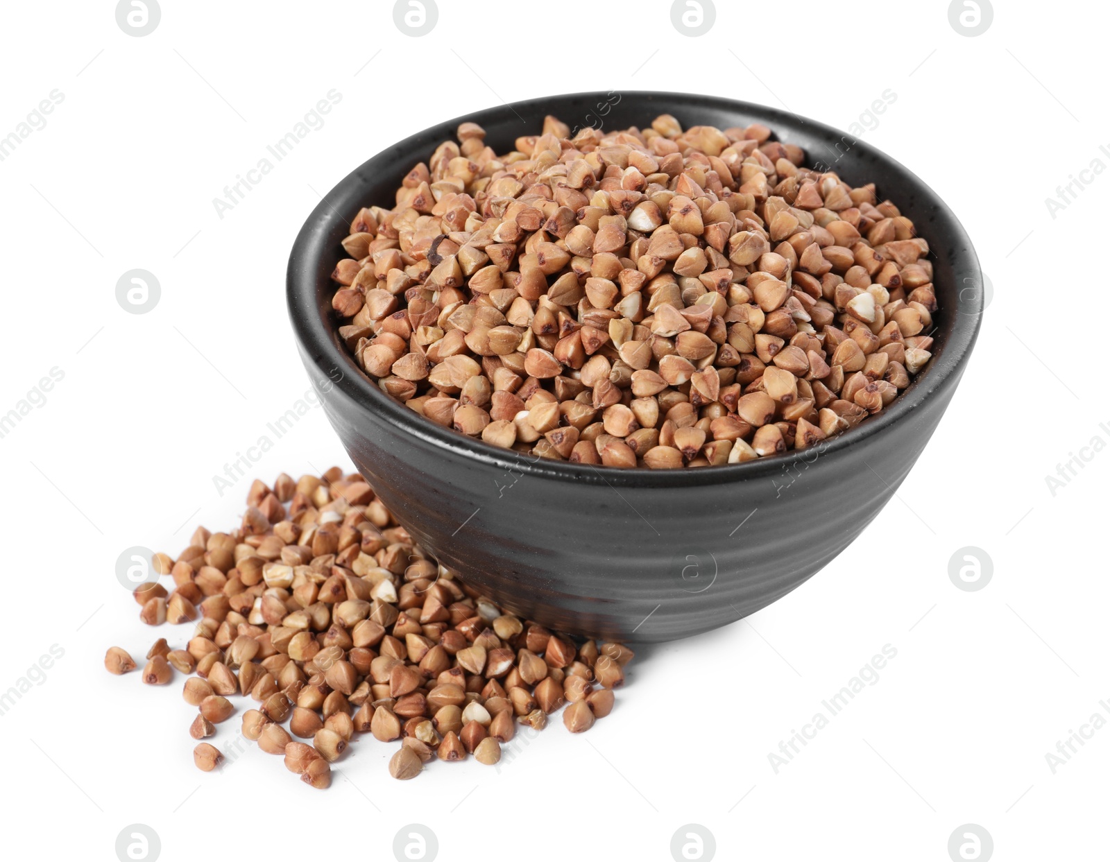 Photo of Raw buckwheat in bowl isolated on white