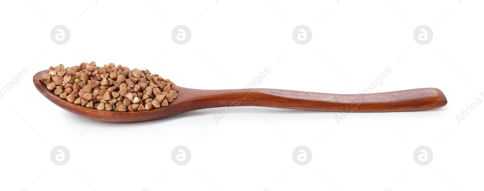 Photo of Raw buckwheat in wooden spoon isolated on white