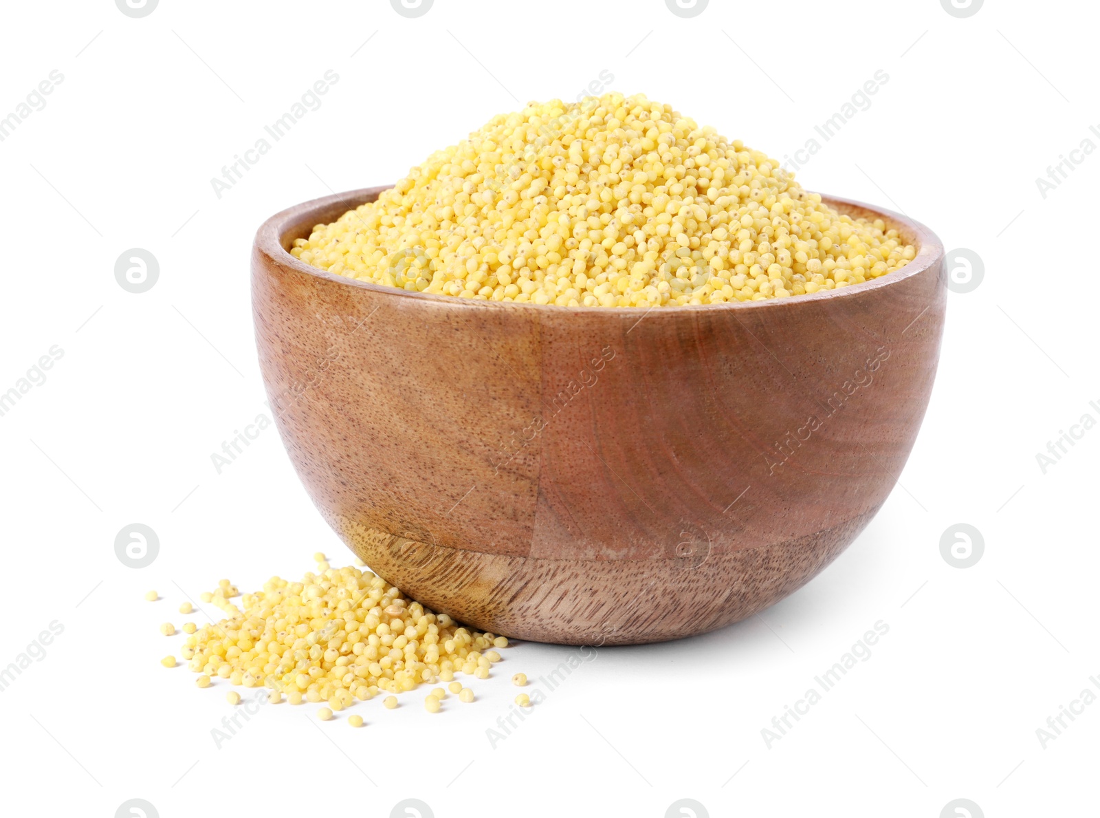 Photo of Millet groats in wooden bowl isolated on white