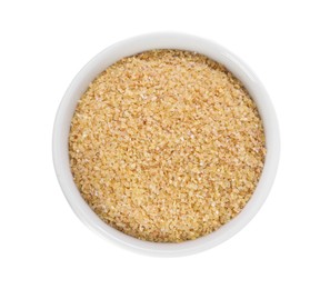 Raw wheat groats in bowl isolated on white, top view