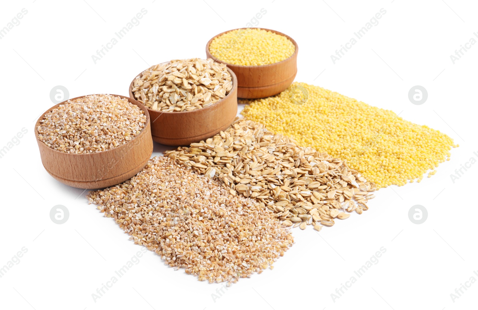 Photo of Piles of different cereals and bowls isolated on white