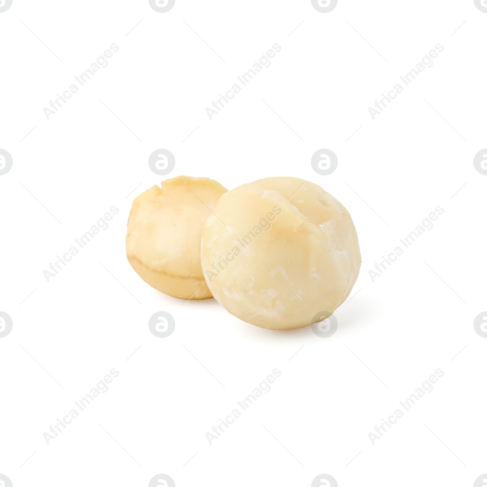 Photo of Whole peeled macadamia nuts isolated on white