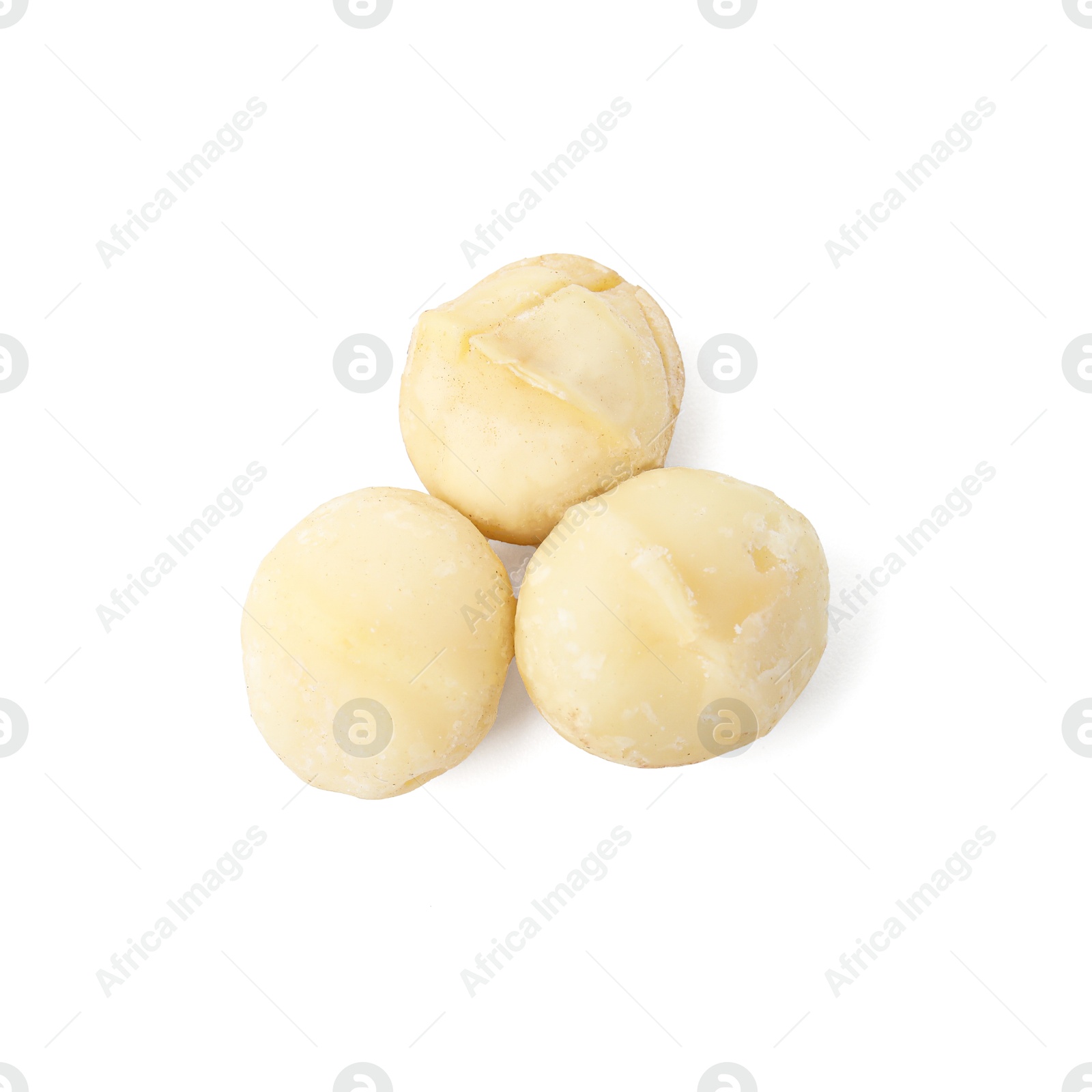 Photo of Whole peeled macadamia nuts isolated on white, top view