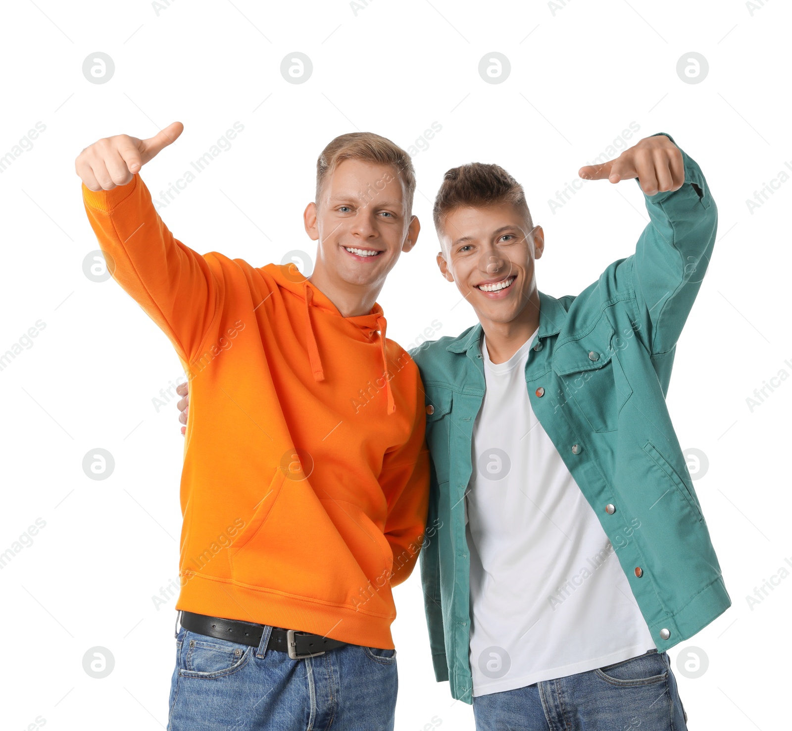 Photo of Two young brothers having fun on white background