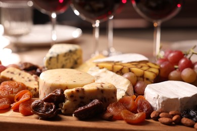 Different tasty snacks on table, selective focus