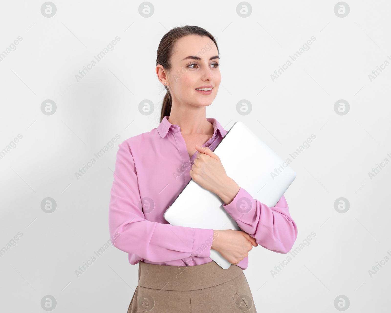 Photo of Portrait of smiling businesswoman with laptop on white background