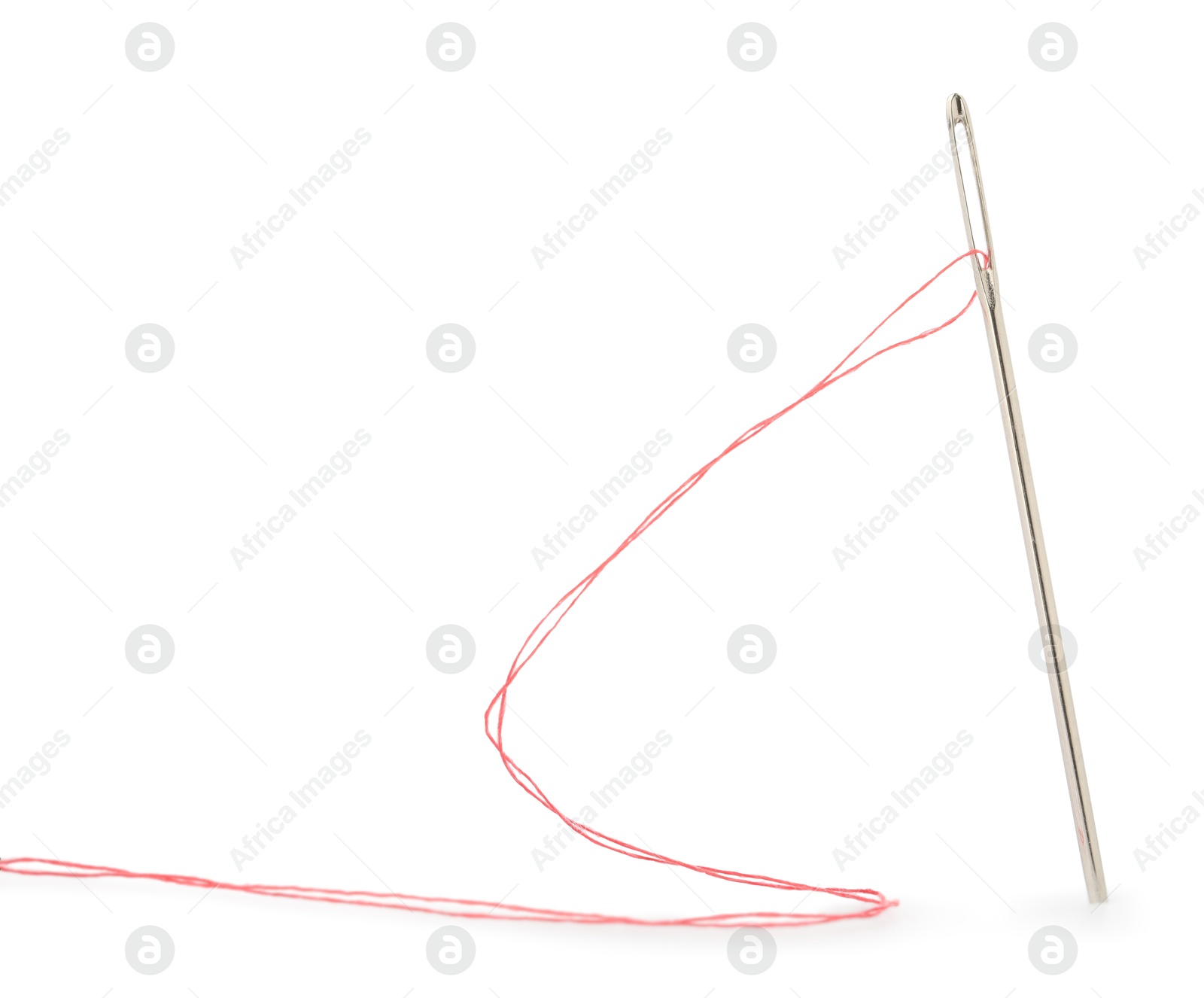 Photo of Sewing needle with red thread isolated on white