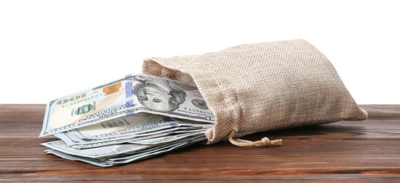 Photo of Dollar banknotes in bag on wooden table against white background