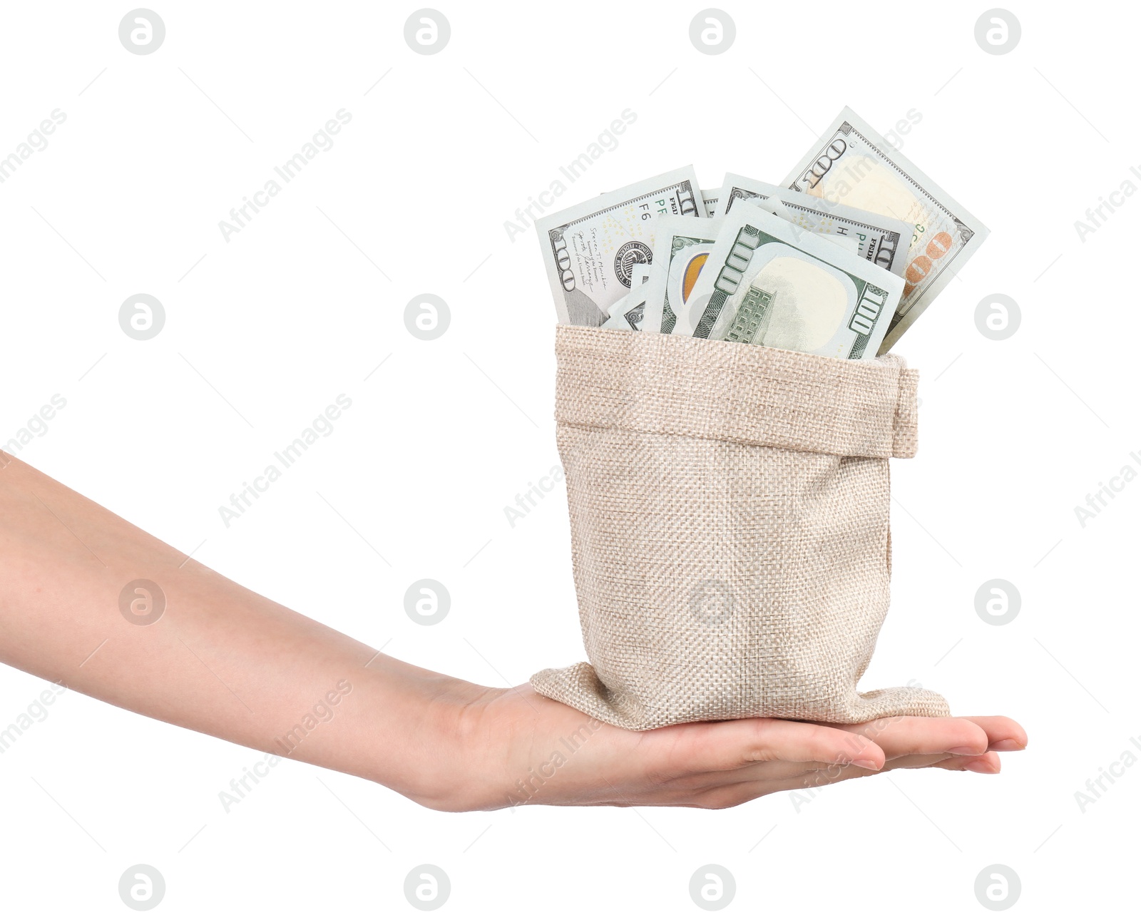 Photo of Woman with bag of dollar banknotes against light background, closeup