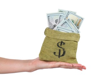 Photo of Woman with bag of dollar banknotes against light background, closeup