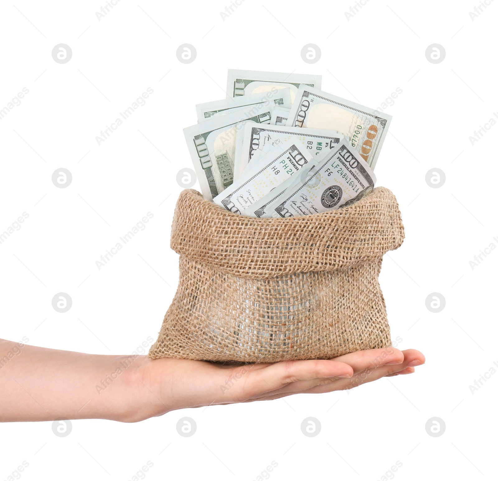 Photo of Woman with bag of dollar banknotes against light background, closeup