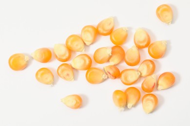 Photo of Pile of fresh corn kernels isolated on white, top view