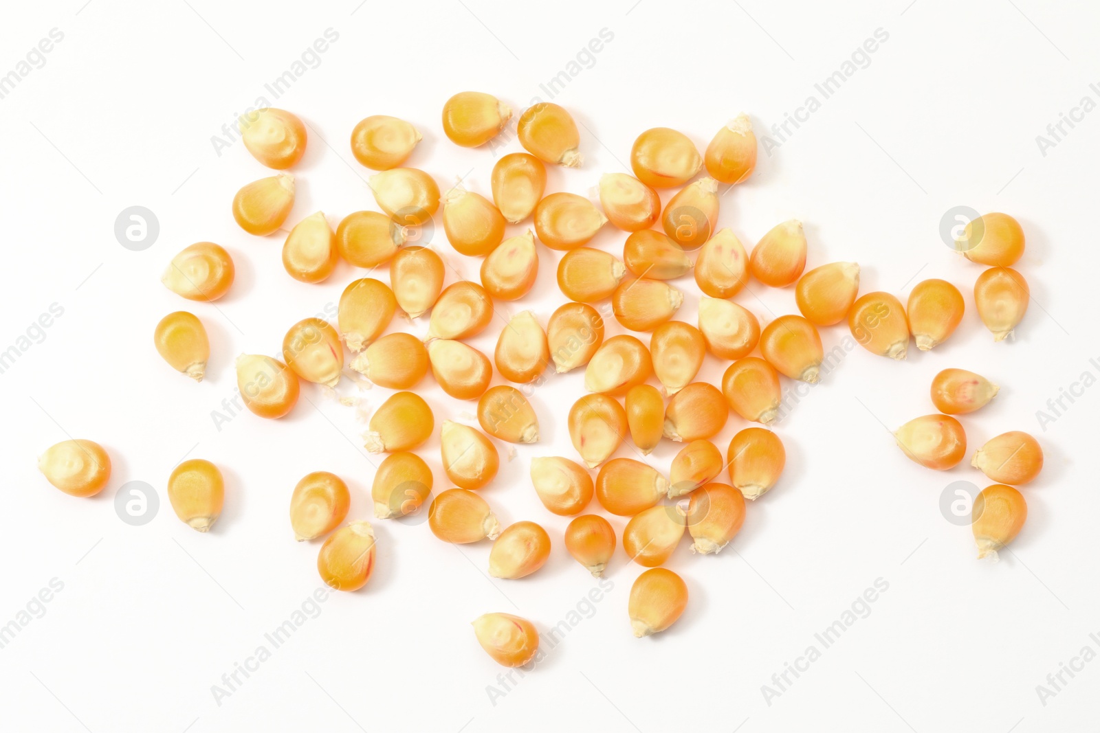 Photo of Pile of fresh corn kernels isolated on white, top view