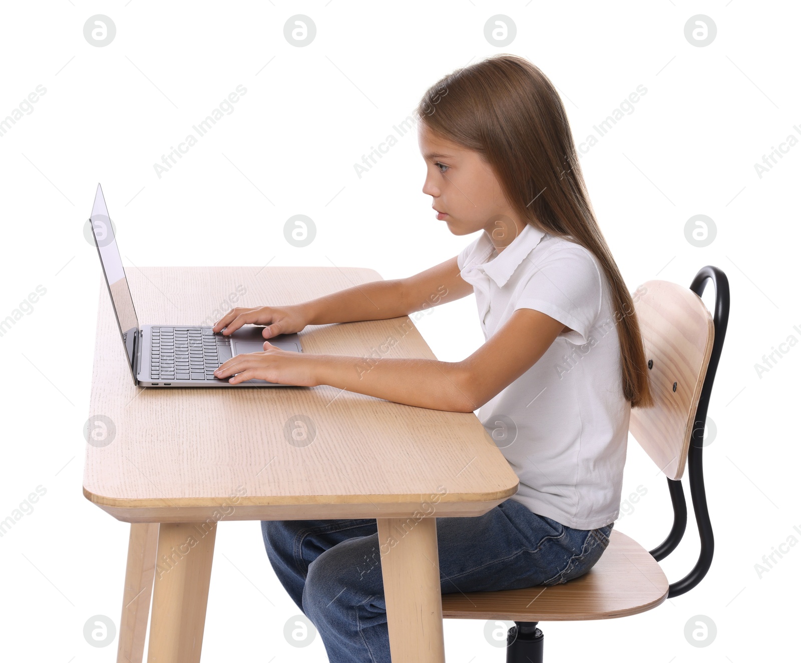 Photo of Girl with incorrect posture using laptop at wooden desk on white background