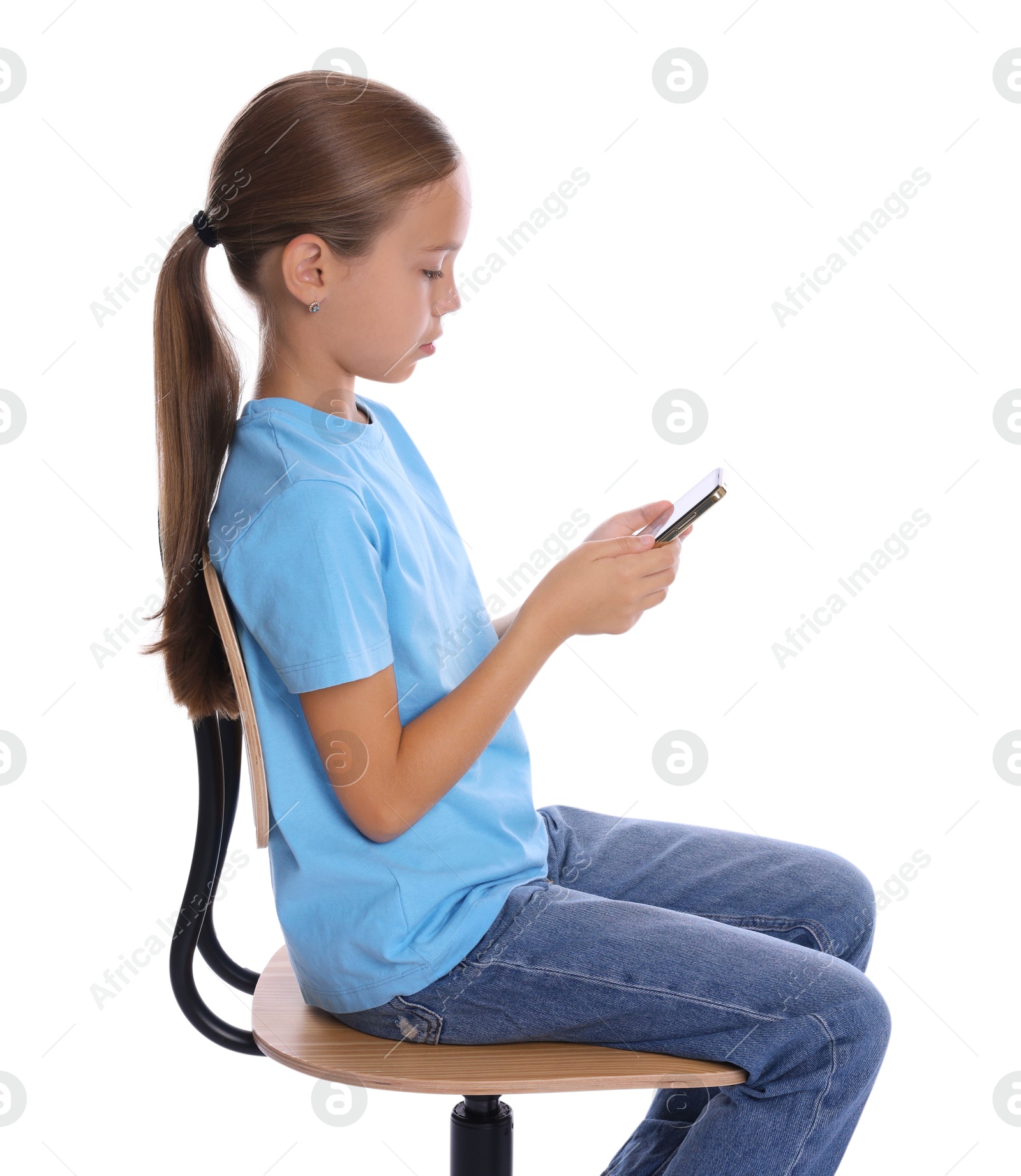 Photo of Girl with correct posture and smartphone sitting on chair against white background