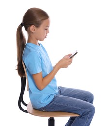 Photo of Girl with correct posture and smartphone sitting on chair against white background