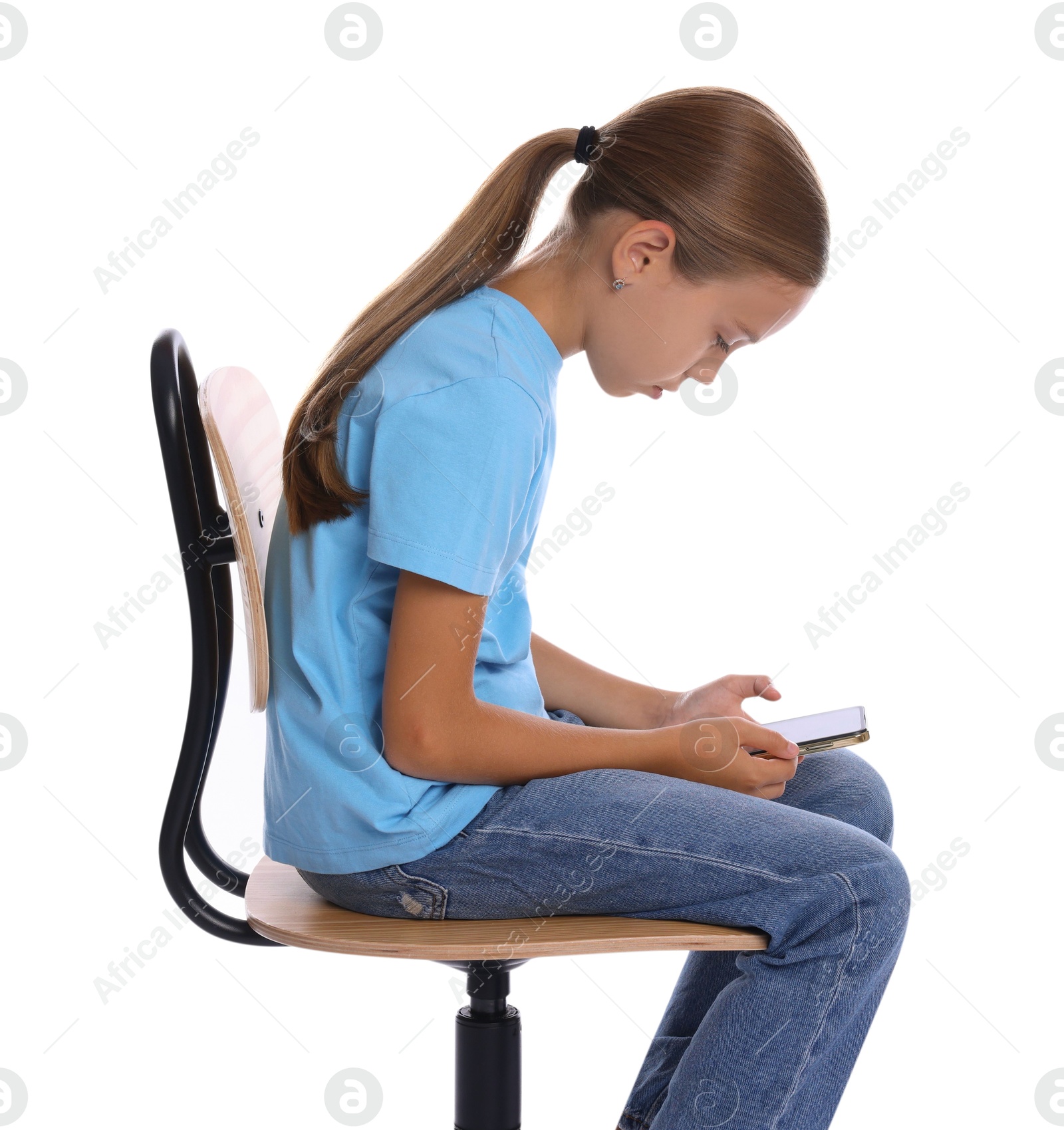 Photo of Girl with incorrect posture and smartphone sitting on chair against white background