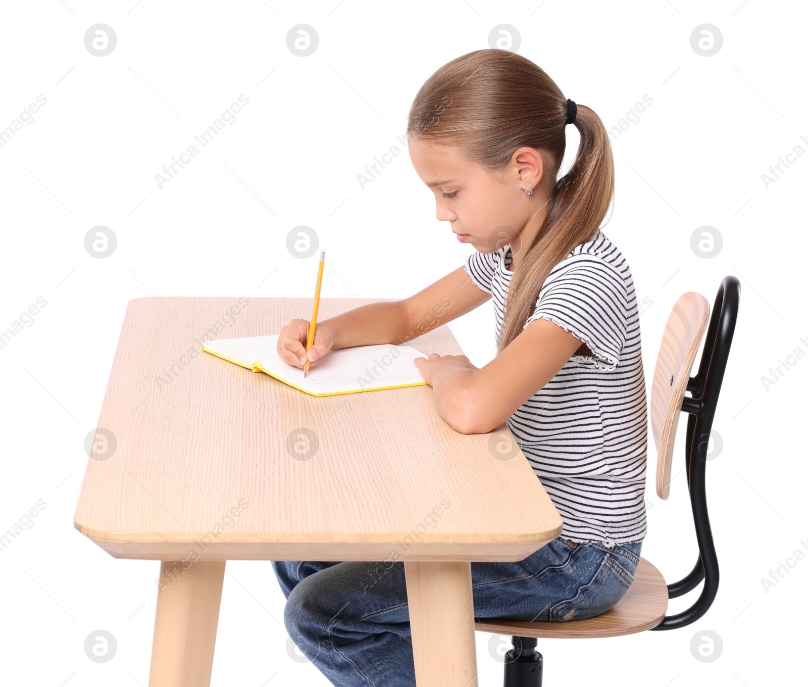 Photo of Girl with correct posture and notebook sitting at wooden desk on white background