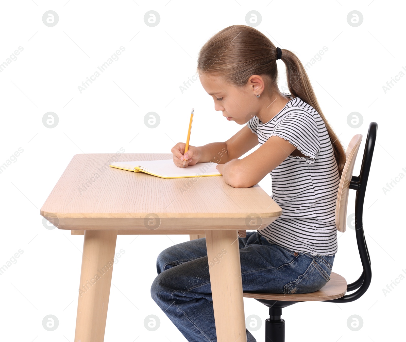 Photo of Girl with incorrect posture and notebook sitting at wooden desk on white background