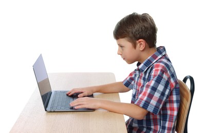 Photo of Boy with incorrect posture using laptop at wooden desk on white background