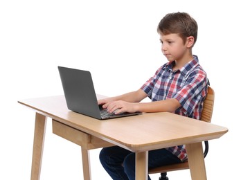 Photo of Boy with correct posture using laptop at wooden desk on white background