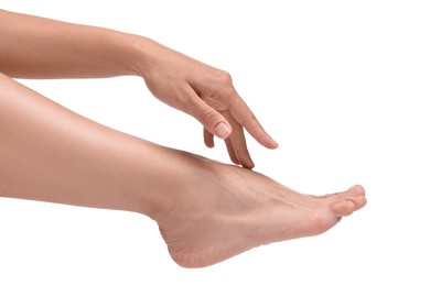 Photo of Woman touching her smooth feet on white background, closeup