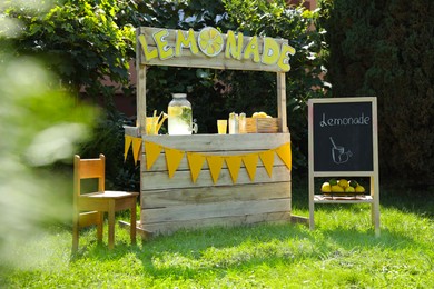 Photo of Lemonade stand with refreshing drink in park