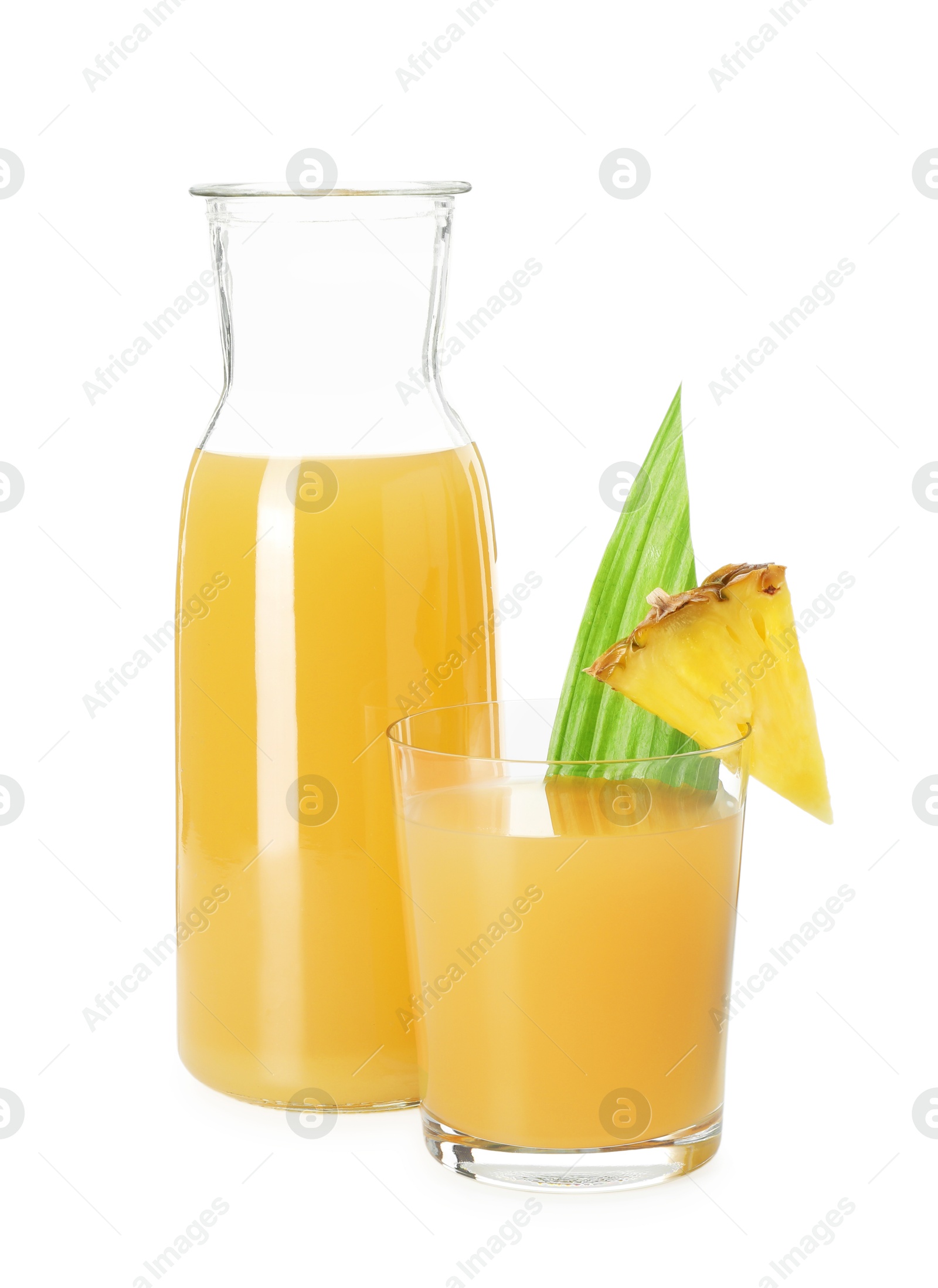 Photo of Glass with tasty pineapple juice, jug and piece of fresh fruit isolated on white