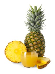 Photo of Glass with pineapple juice and fresh pineapples isolated on white