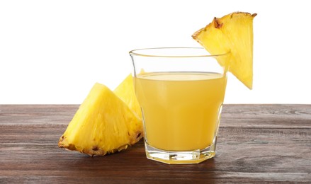 Photo of Glass with pineapple juice and pieces of fresh fruit on wooden table against white background