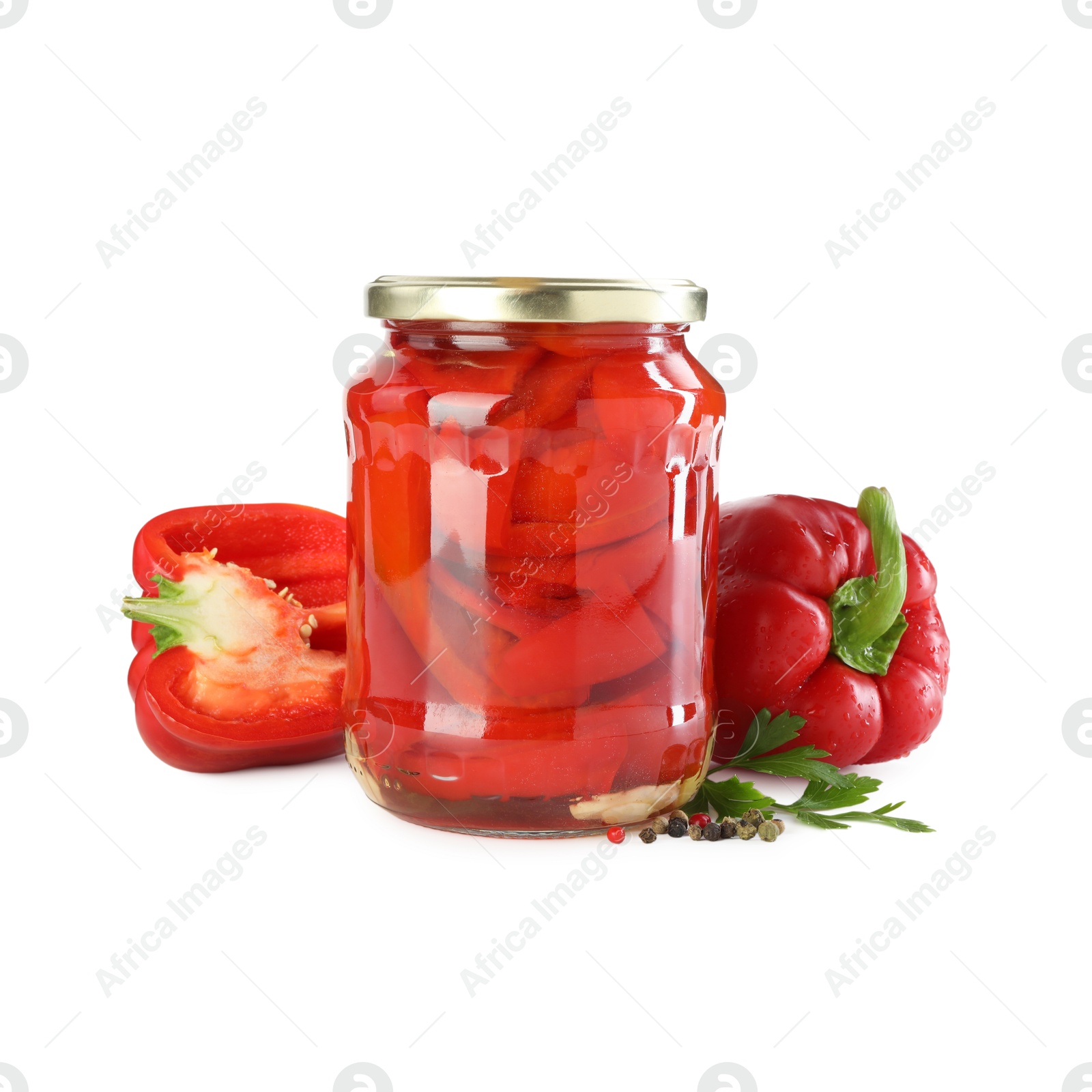 Photo of Tasty pickled bell peppers in jar and fresh ingredients isolated on white