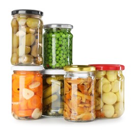 Photo of Different pickled products in jars isolated on white