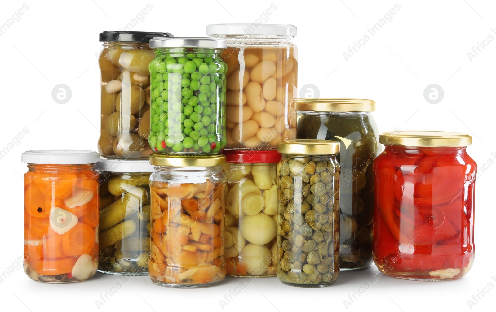 Photo of Different pickled products in jars isolated on white