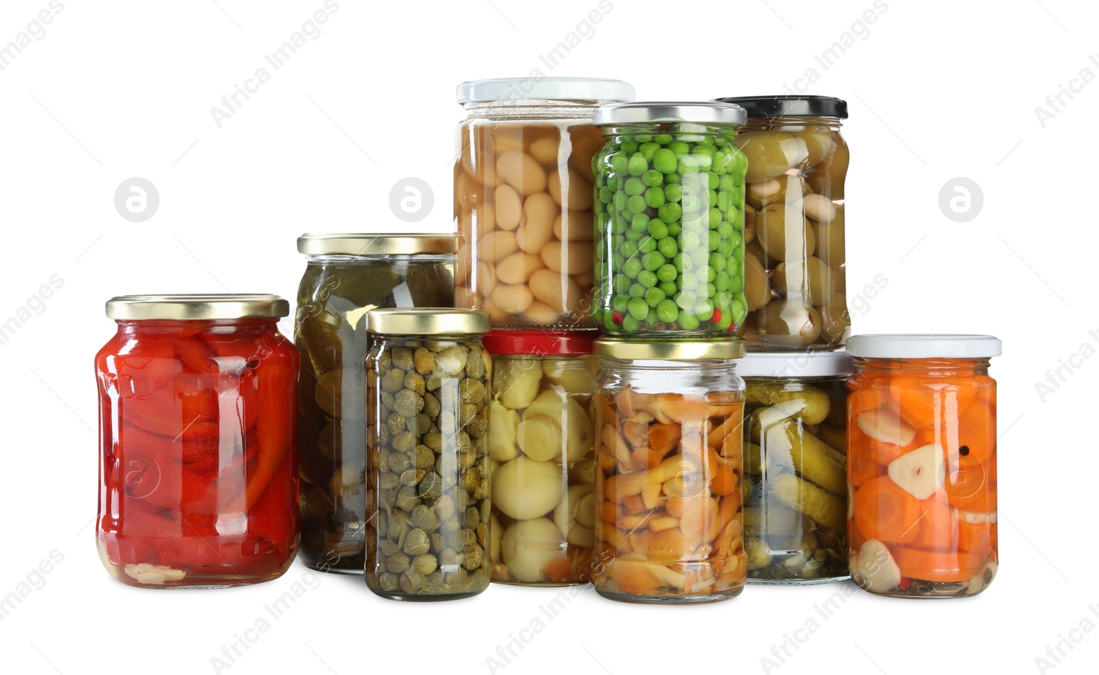 Photo of Different pickled products in jars isolated on white