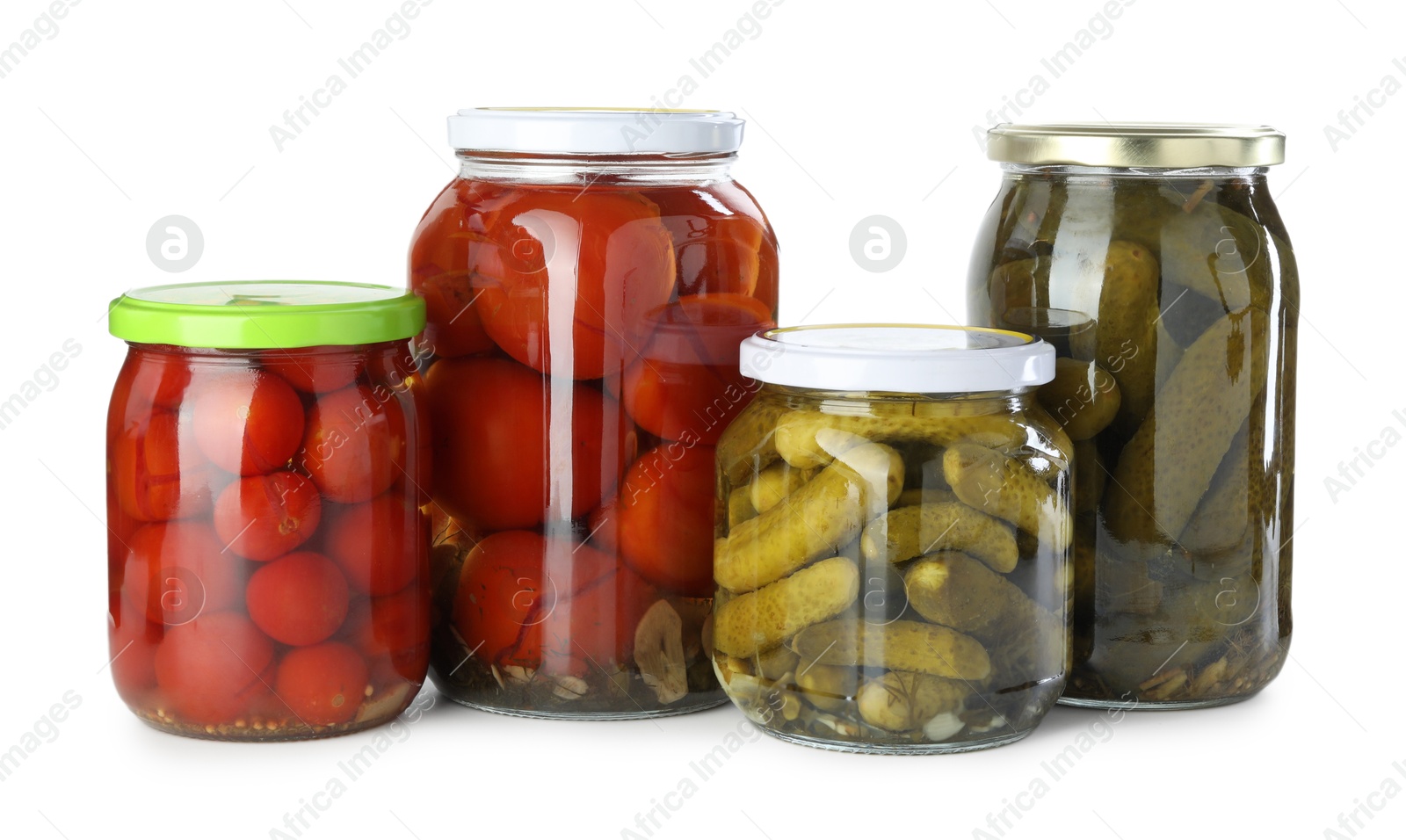 Photo of Tasty pickled tomatoes and cucumbers in jars isolated on white