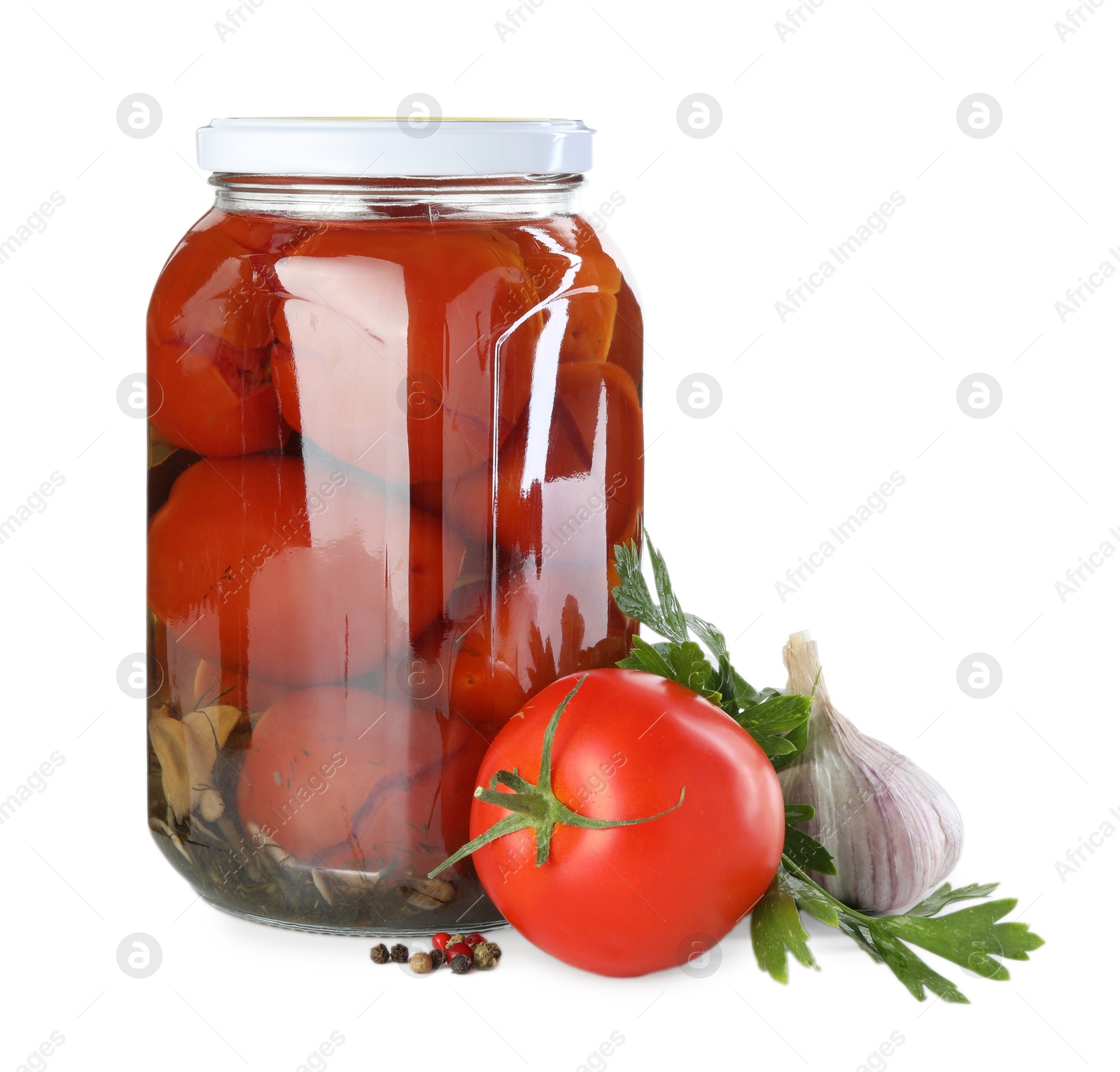 Photo of Tasty pickled tomatoes in jar, fresh vegetable and spices isolated on white