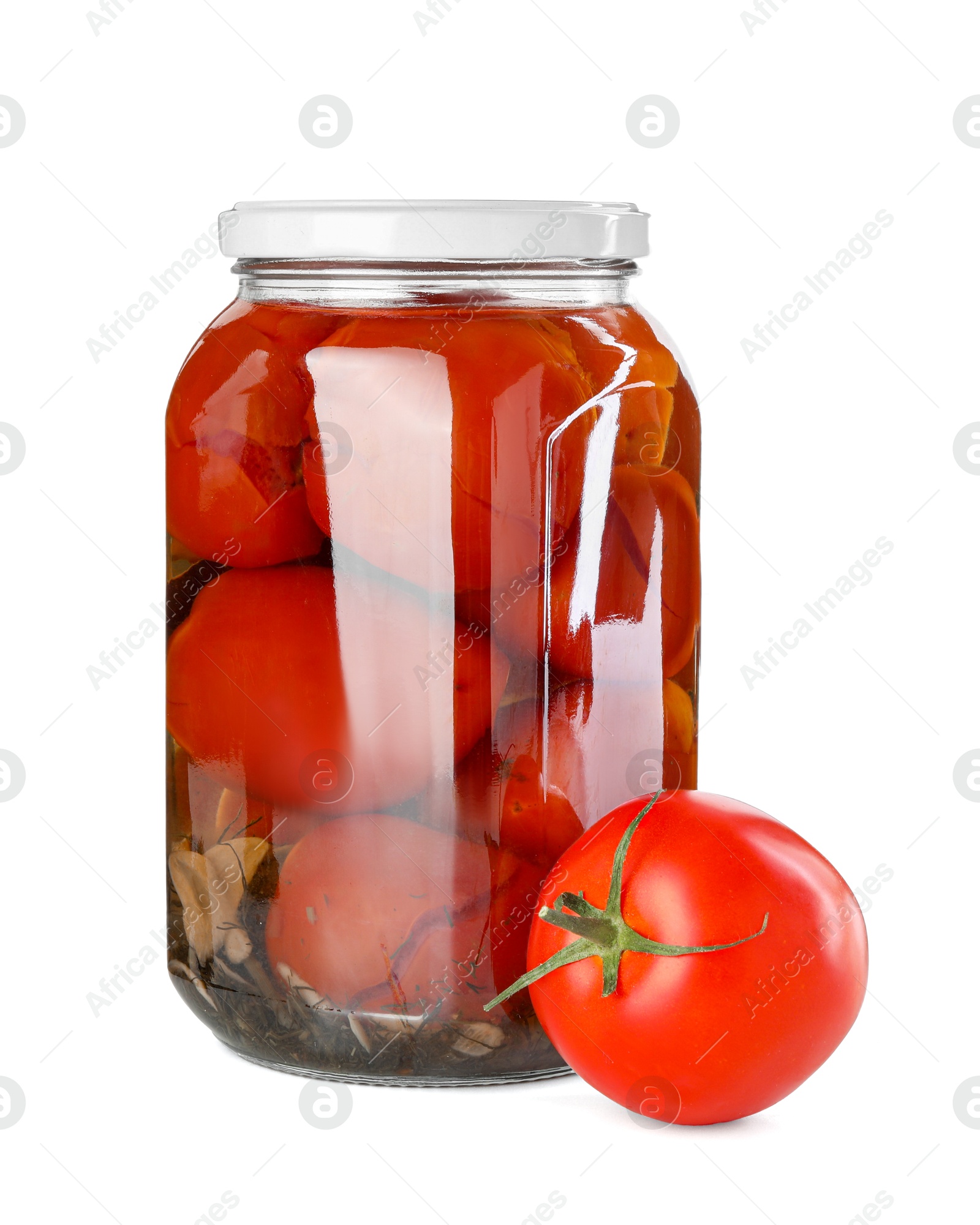 Photo of Tasty pickled tomatoes in jar and fresh vegetable isolated on white